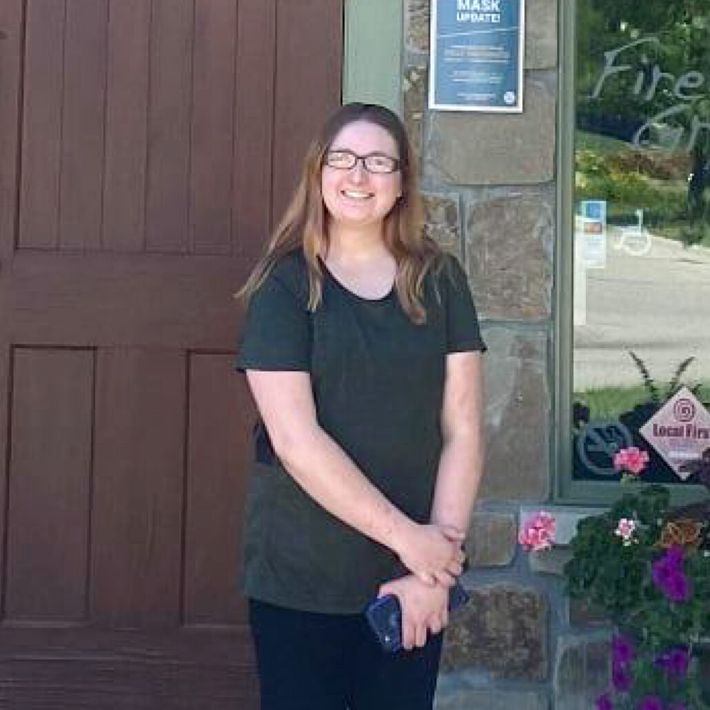 Image of Beyond26 worker in front of Fire Rock Grill